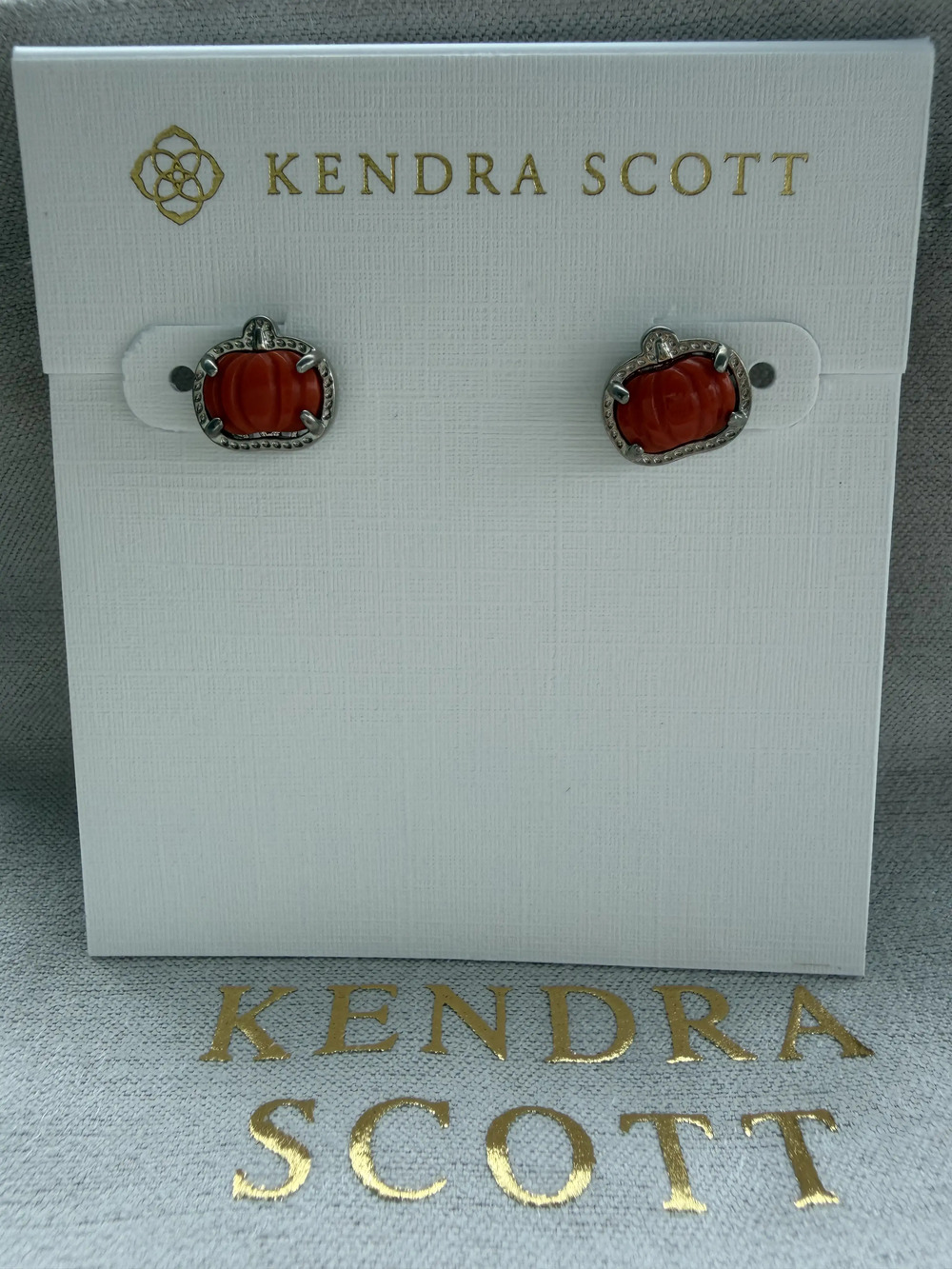 Kendra Scott's red pumpkin earrings